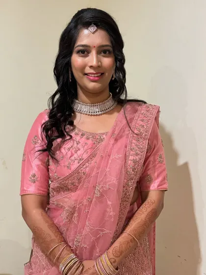 Ramya looking radiant and happy. The saree drape is secure and neat, allowing her to enjoy the event without any fuss. It's about feeling good in what you wear.