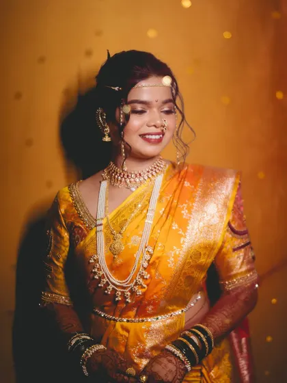 A glowing portrait of the bride, with beautiful lighting enhancing her dewy makeup.