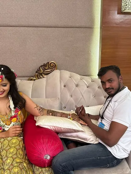 Posing with a client after completing her beautiful arm mehndi. Seeing my clients happy with their designs is the most rewarding part of my job.