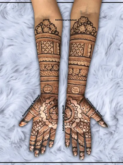 A stunning engagement bridal design with matching mandala patterns on both palms. The arms are filled with detailed geometric and floral bands.