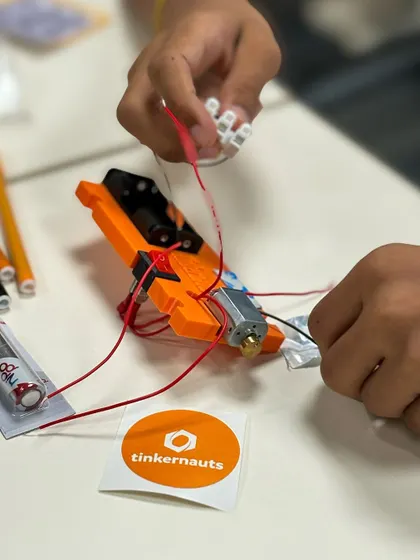 A close-up of a student's hands wiring a project at the Yahoo India event. These are the moments where learning clicks into place.