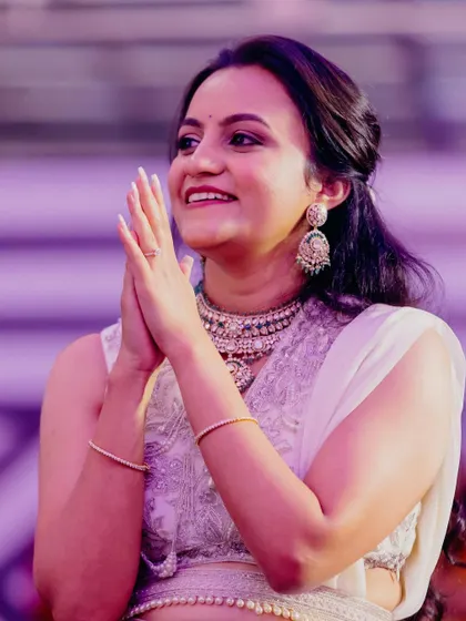 A candid shot from a Sangeet night. Her makeup is glowing under the party lights, and her smile says it all.