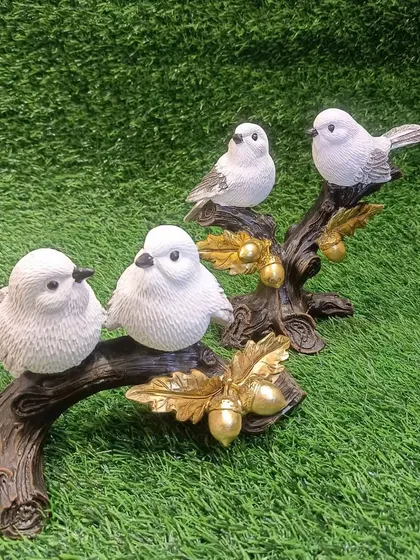 A set of two bird couple showpieces, perfect for creating a symmetrical and balanced display on a mantel or shelf.