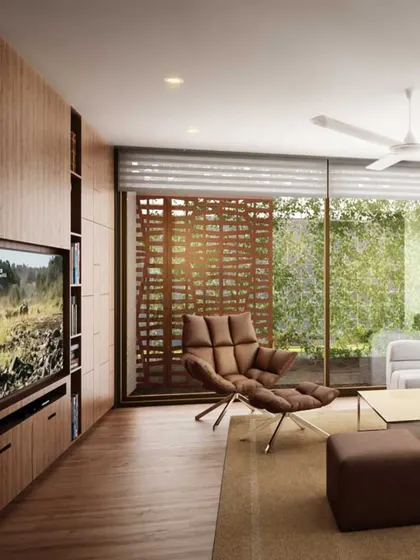 This family room is designed for comfort and relaxation, with a deep lounge chair and warm wood paneling. The slatted screen outside provides privacy while still allowing light and views of the garden to filter through.
