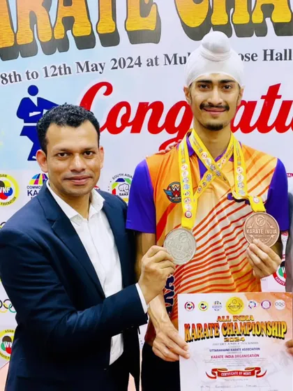 Receiving my medals from my Guru, Aniket sir. A teacher's guidance is the foundation of a student's success.
