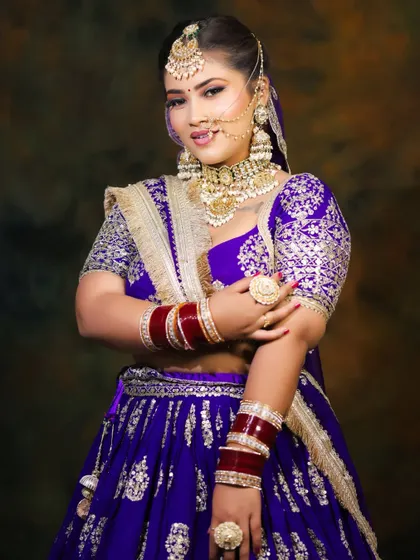 This student work features a stunning royal purple lehenga with coordinated makeup. Learning color theory is essential to creating such cohesive and striking looks.