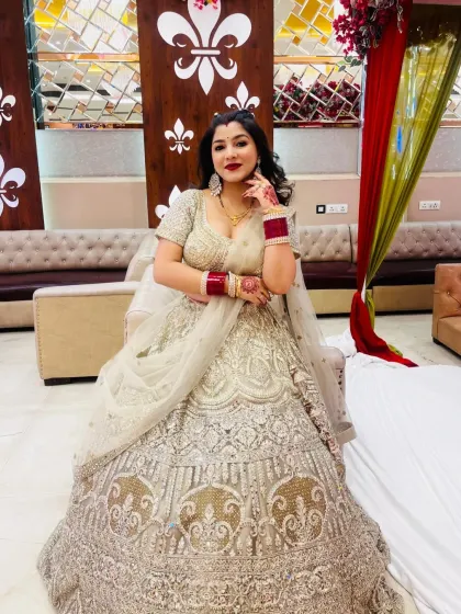 A series of photos of my happy client looking absolutely stunning in a heavily embroidered silver-grey lehenga at her reception. She owned the look completely!