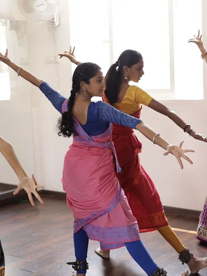 Students practicing in unison during a group class. The synchronized movement highlights the discipline and joy of learning together in this space.