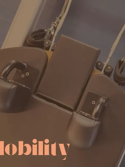 Pilates is the complete coordination of body, mind, and spirit. This close-up on the reformer highlights the equipment that facilitates improved mobility and mindfulness.