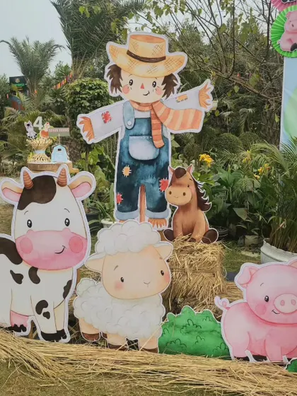 A group of friendly farm characters, including a scarecrow, cow, sheep, and pig. These large cutouts are perfect for photo opportunities and bringing the theme to life.