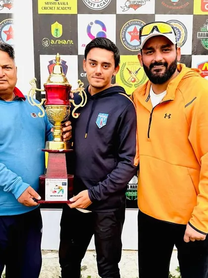 Posing with the trophy after winning the 9th Bhagwan Parshuram Open Cricket Tournament. A proud moment for me and my player.