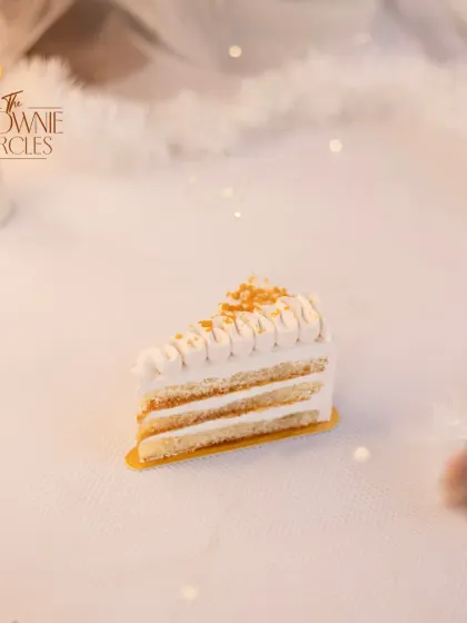 A slice of my Butterscotch pastry, with layers of caramel-infused sponge and light cream, topped with crunchy butterscotch pieces.