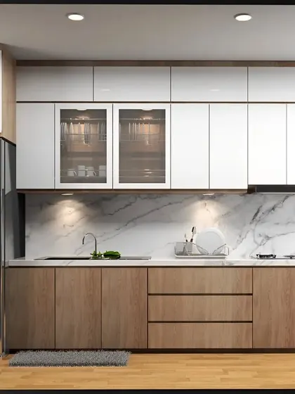 A clean and contemporary kitchen design featuring two-tone cabinetry in natural wood and glossy white. The marble backsplash and under-cabinet lighting create a bright and luxurious workspace.