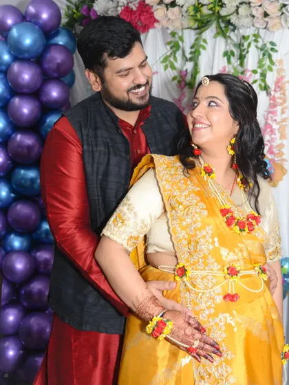 A tender pose with the husband holding his wife and her baby bump. These are the intimate portraits that couples cherish.