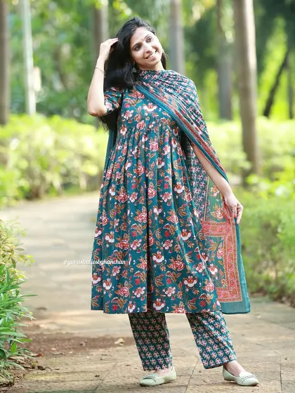 Unveil elegance this festive season with our exquisite teal floral dupatta suit. A must-have for every celebration.