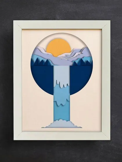 Hung on a dark wall, the light colors of the waterfall scene pop, making it a captivating piece of wall decor.