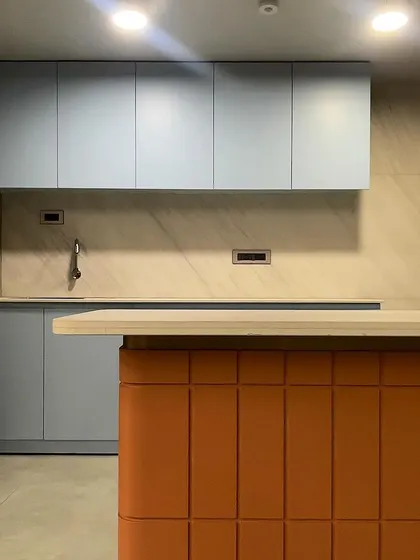 A duplicate image of the colorful and contemporary office pantry.