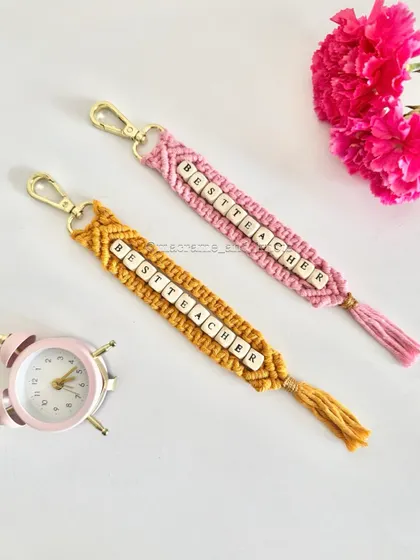 A special handmade gift for the teachers who guide us. These "Best Teacher" macrame keychains are a thoughtful way to show appreciation, customized with letter beads and available in different colors.