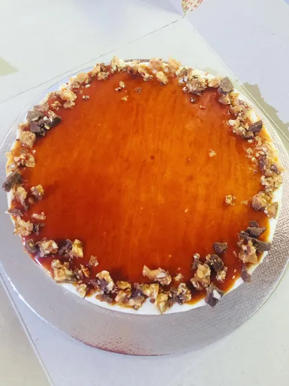 A quick picture of this salted caramel lighter cheesecake while packing it up for delivery. The crunchy, nutty topping adds a wonderful texture to the creamy cake.