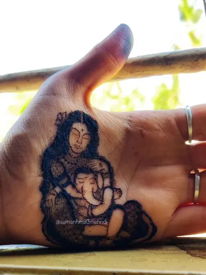 Even gods need a mother's love. This portrait of Goddess Parvati with baby Ganesha is a tribute to the universal bond between a mother and child, created for a Gowri Ganesha festival.
