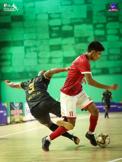 A player dribbling past a defender with ease.