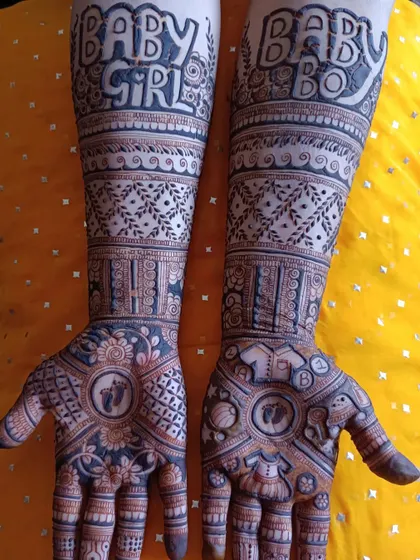 A fun and playful baby shower mehendi! This design includes "Baby Girl" and "Baby Boy" on the forearms, adding a touch of suspense and excitement to the celebration.
