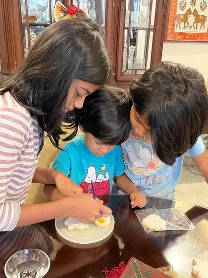 A heartwarming moment of family collaboration over a cookie painting session. These kits are a great way to make sweet memories together.