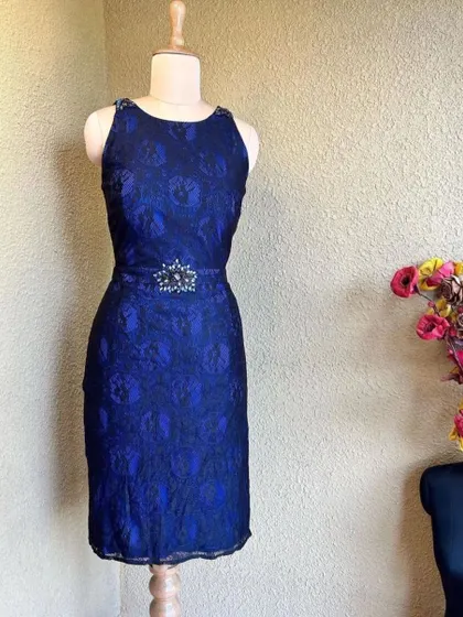 This stylish blue and black lace dress is a great rental option for a formal party or a night out.