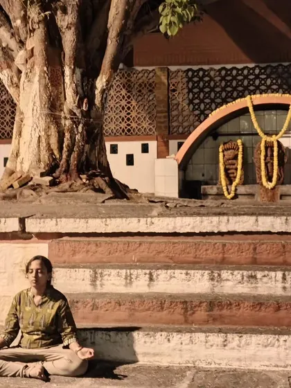 Another photo of me meditating near a temple, finding serenity in spiritual places.