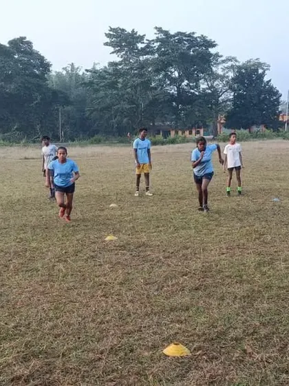 Running drills during a morning rugby session. We support our partner academies in providing structured training that helps young athletes develop their skills and physical fitness.