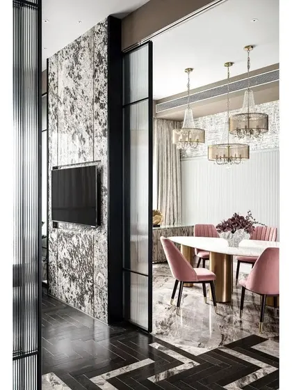A view from the den into the dining area, framed by tall, fluted glass sliding doors. This demonstrates how I use architectural elements to create separation and privacy without sacrificing light or a sense of spaciousness.