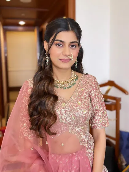 A beautiful portrait capturing the soft glam makeup. The look is perfect for a sangeet or engagement, offering a balance of elegance and warmth.