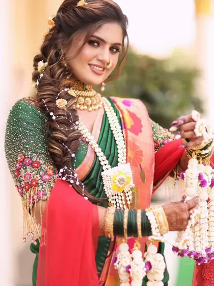 A close-up of the bride's beautiful smile and our custom floral kalire. The details in the jewellery are designed to stand out.