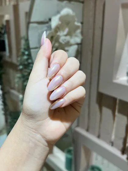 Another shot of the stunning glazed chrome nails, showing off their beautiful sheen and elegant almond shape.