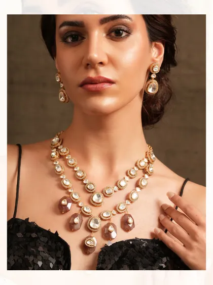 A layered polki necklace with large, uncut stones, creating a look of raw and rustic luxury.