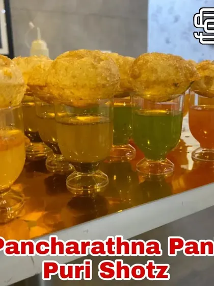 I've reinvented a classic with my Pancharathna Pani Puri Shots. Served in stylish shot glasses with a variety of flavored waters, it's a modern and fun way to enjoy India's favorite street food.