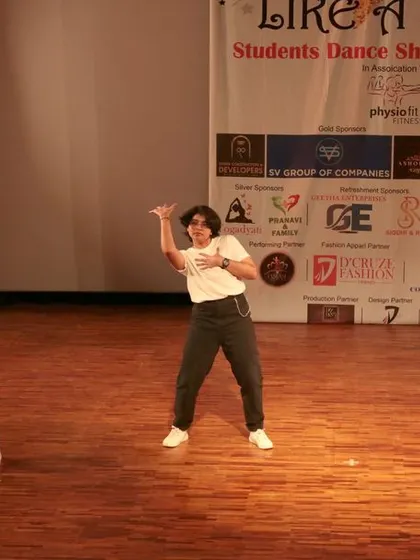 A trio of male dancers showcasing their skills in a synchronized hip-hop routine.