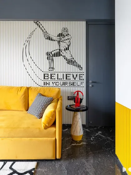 A different angle of the boy's room, showing how the yellow sofa bed provides a comfortable spot for relaxing. The design is modern, energetic, and perfectly suited for a growing boy.
