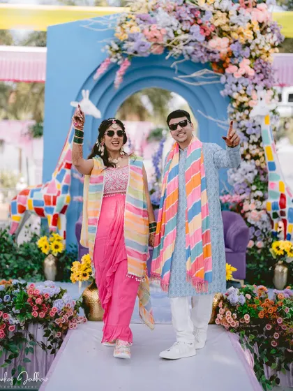The couple makes a cool, confident entrance to their fun-filled Haldi party.