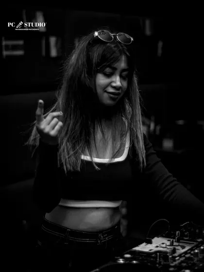 A monochrome photo showing the vibe of the night. The music takes over and I just go with the flow, connecting with the crowd through the sound.