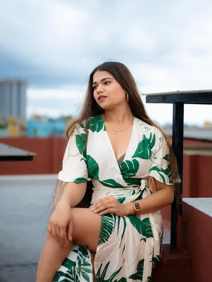 A duplicate of image 76, this rooftop portrait with a city view creates a dramatic and stylish fashion shot.