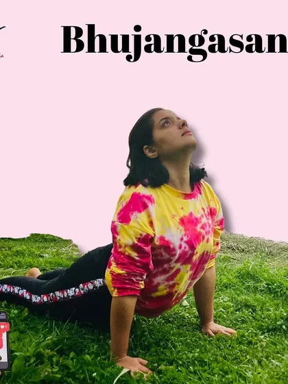 Here I am demonstrating Bhujangasana (Cobra Pose) in a natural outdoor setting, a pose that gently stretches the abdomen and can improve circulation to reproductive organs.