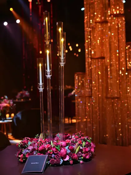 A beautiful centerpiece against the shimmering backdrop of the crystal waterfall installation.