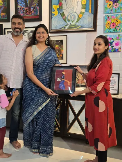 Artist Nikitha presents her sold artwork to the new collectors. These moments of connection between artist and patron are what our gallery is all about.