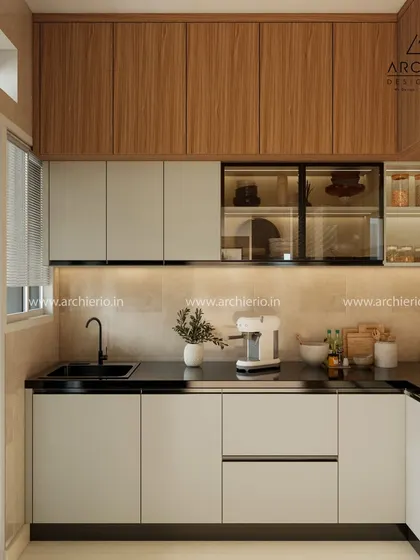 This kitchen design shows a beautiful contrast between wood-grain and solid off-white cabinets, enhanced by under-cabinet lighting for a warm glow.
