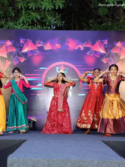 We also cover school functions and corporate events. This photo captures a group of young performers on stage during a cultural fiesta, showcasing their coordinated effort and colorful costumes.