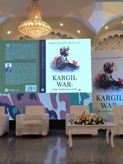 A clear view of the LED screen and stage setup for the book launch.