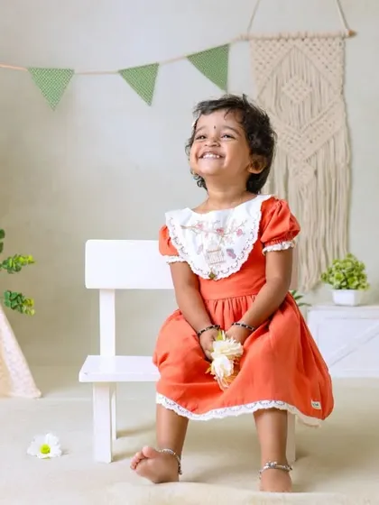 My boho-themed sessions use natural textures like macrame, wood, and greenery to create a calm and earthy setting that beautifully complements your child's simple joy.