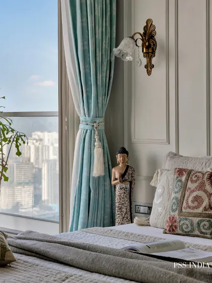 Softness in every corner, sophistication in every detail. This dreamy bedroom blends classic design, with its intricately carved moldings and pastel blue accents, with the calming energy of a modern sanctuary.