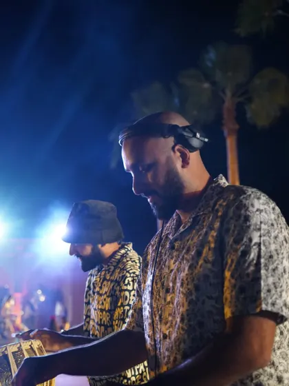 A candid shot of me and my DJ partner on the decks during a wedding in Marrakech. The energy between us is what fuels the party.